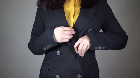 Front View on Body Part of Young Female in Yellow Blouse and Black Jacket