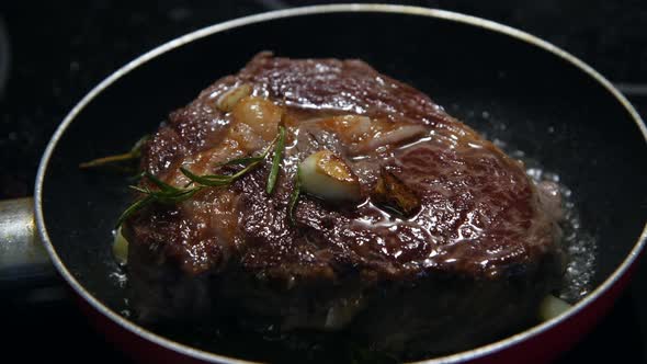 chuck steak frying on frying pan