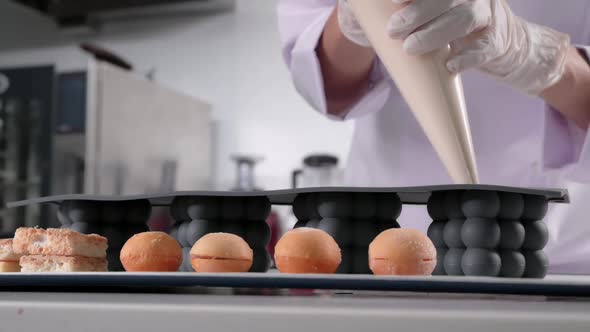 Pastry Chef Pours the Cream Into a Silicone Cake Mold