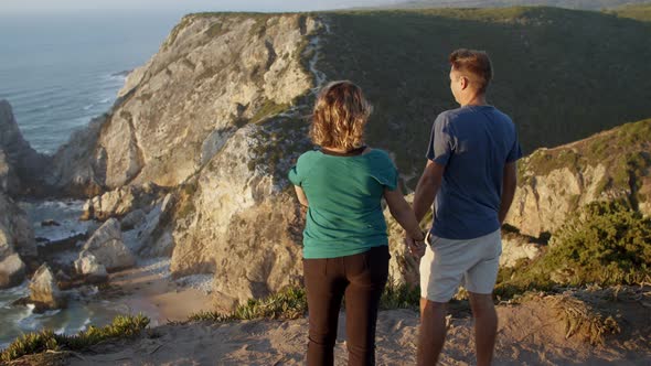 Married Couple of Hikers Holding Hands