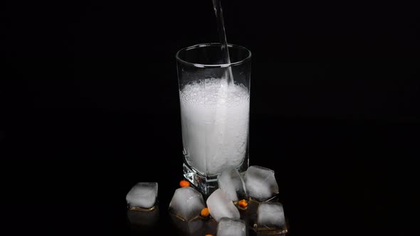 Glass of soda and ice cubes