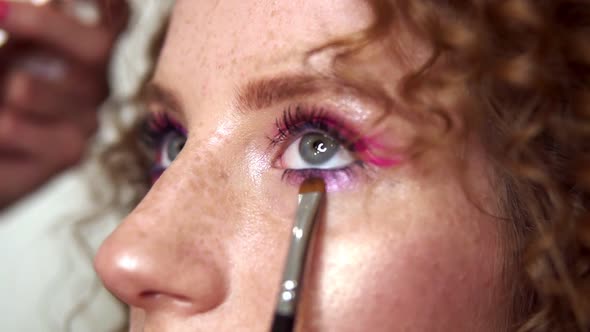 Portrait of a Young Woman During Professional Makeup