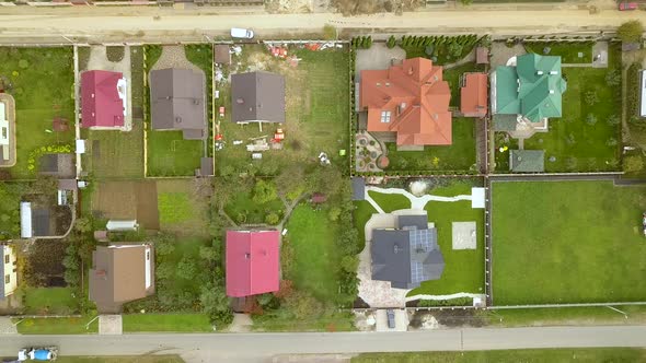 Aerial view of home roofs in residential rural neighborhood area.