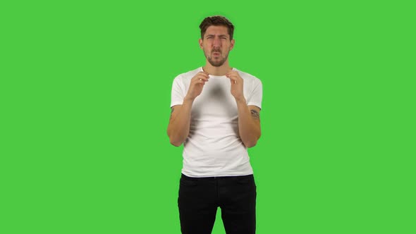 Confident Frustrated Guy Is Saying Wow with Shocked Facial Expression. Green Screen
