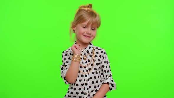 Little Blonde Child Kid Girl Waves Hand Palm in Hello Gesture Welcomes Someone Positive Emotions