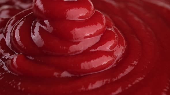 Pour Ketchup sauce close up. 4K UHD video