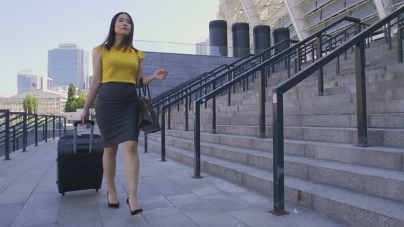 Asian Business Lady Walking with Suitcase Luggage