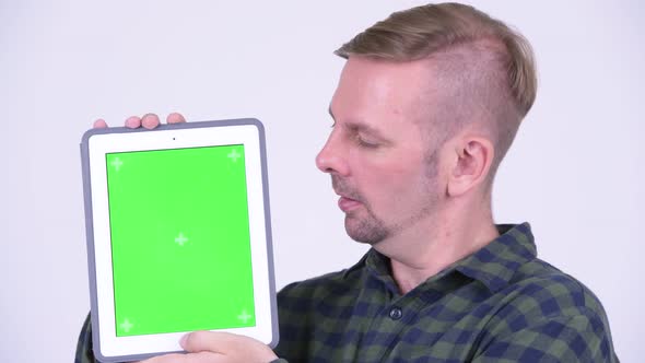 Happy Blonde Hipster Man Showing Digital Tablet