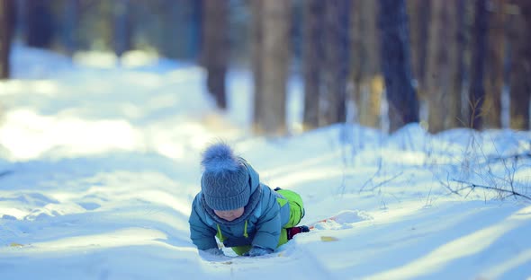 Kid is Trying to Get Out of a Snowdrift