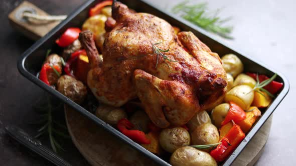 Delicious Whole Chicken Cooked with Pumpkin, Pepper and Potatoes. Served in Metal Baking Pan.