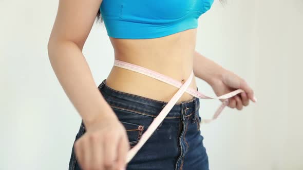 woman with measuring tape on waist