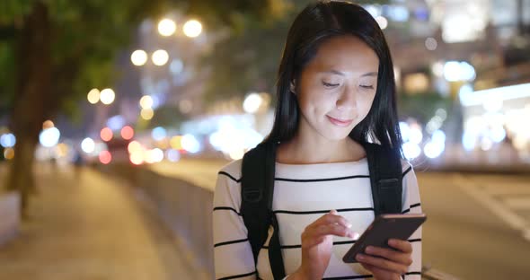 Young woman use of smart phone in city