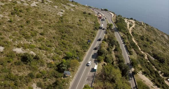 Hill side roads in Croatia with slow reveal of beautiful blue sea on a sunny day