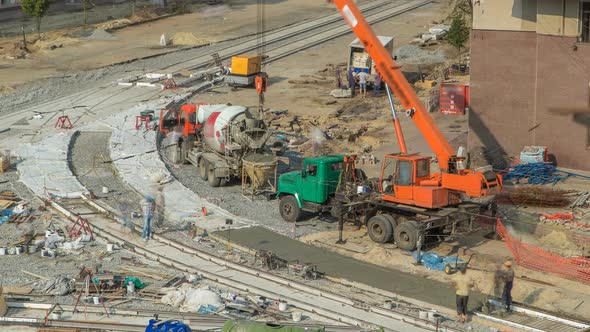 Concrete Works for Road Construction with Many Workers and Mixer Timelapse