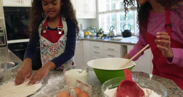 Family making Christmas cookies at home 4k