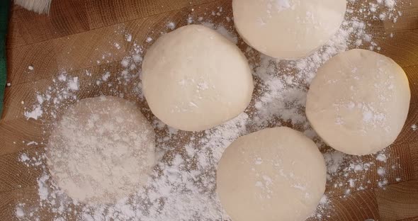 Stopmotion Flat Lay Food Video Loaves Appear One By One on the Wooden Board in the Kitchen 60p