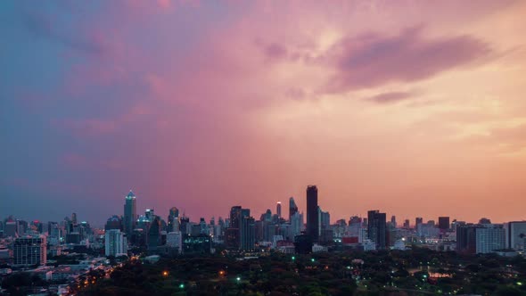 Day and night transition time lapse of cityscape and buildings in metropolis