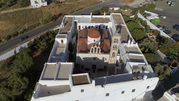 Aerial view of Agios Nikolaos church in Spetses next to a road, Greece.