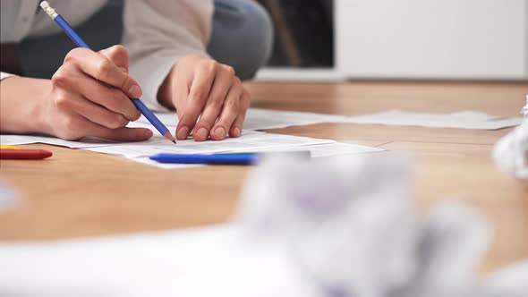 Woman Businesswoman, Accountant With Pencil Checks Calculation Of Business Data Accounting Document