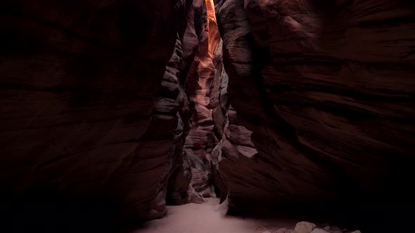 Mysterious Deep Slot Canyon With Wavy And Smooth Orange Red Stone Rock Walls