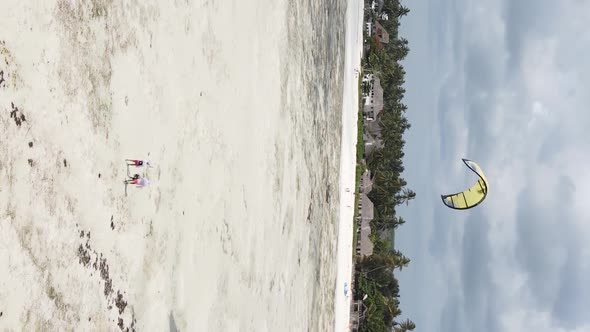 Zanzibar Tanzania  Vertical Video Kitesurfing Near the Shore of Ocean Slow Motion