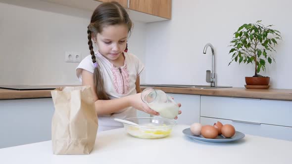 Little Girl Learns To Cook in the Kitchen and Make Bakery