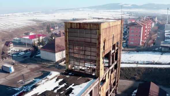 Aerial descending at dilapidated abandoned industrial factory of Vlahita, Romania