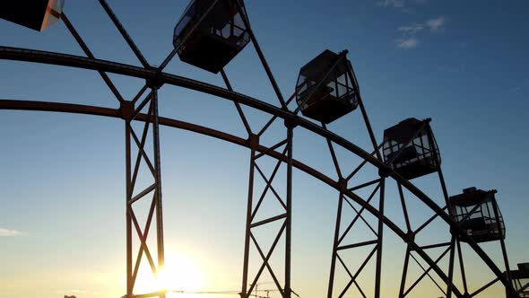 Ferris Wheels Against the Blue Sky