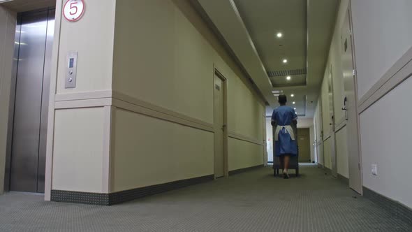 Female Hotel Housekeeper at Work