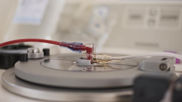 Close Up View of Tube Through Which Blood is Pumped on Apparatus for Collecting Blood From Patients