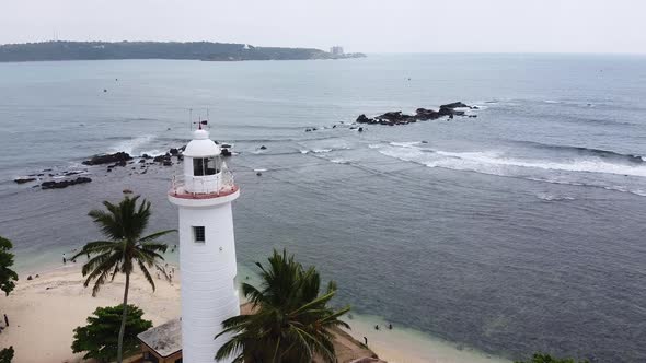Aerial Footage of White Lighthouse in Galle Fort, Sri Lanka