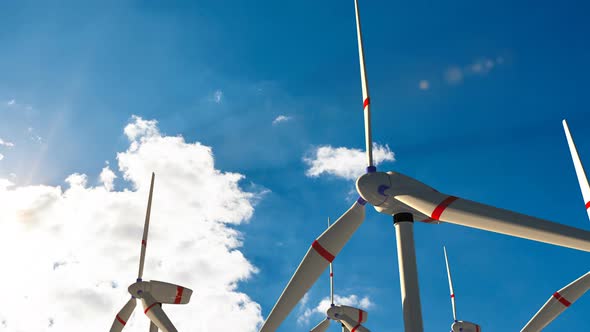 Aerial View of Summer Countryside with Wind Turbines and Agricultural Fields