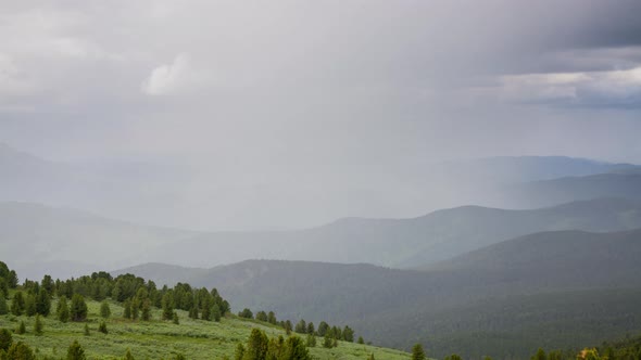 top view of the valley, where the sun replaces the rain, timelapse