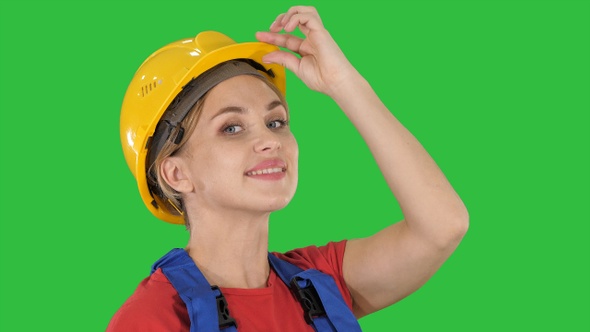 Female construction worker greeting on a Green Screen, Chroma Key