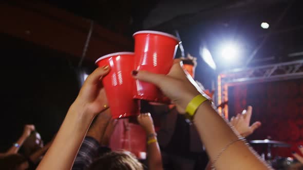 Group of people dancing at a concert 4k