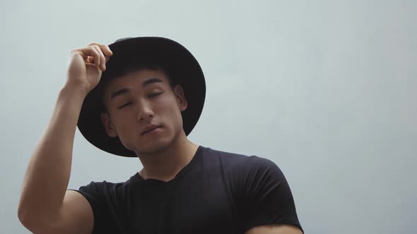 Fashion Asian Man Portrait in Black Clothes