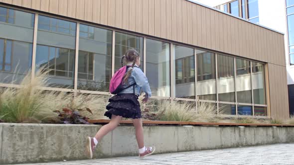 An Elementary School Student Hurries to School