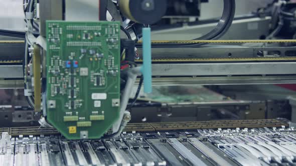 Surface Mount Technology SMT Machine places components on a circuit board