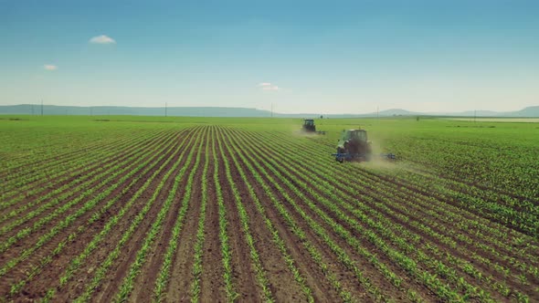 Tractor Cultivating Field At Spring, Aerial View. 