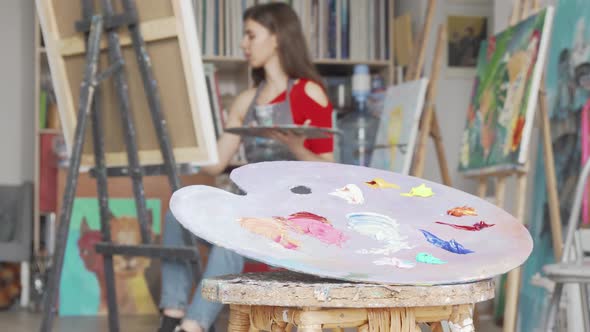 Selective Focus on a Palette at Art Studio of a Young Female Artist