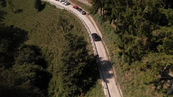 Black car drives to the Restaurant on mountain Brè in Lugano, Ticino, aerial