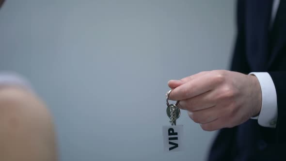 Hotel Host Giving Keys to VIP Client, Luxury Service in Five Star Hotel, Closeup
