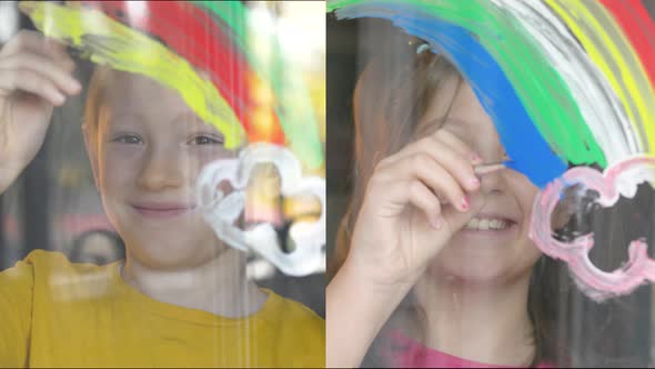 boy and girl are drawing rainbow on the home's windows in during coronavirus lockdown