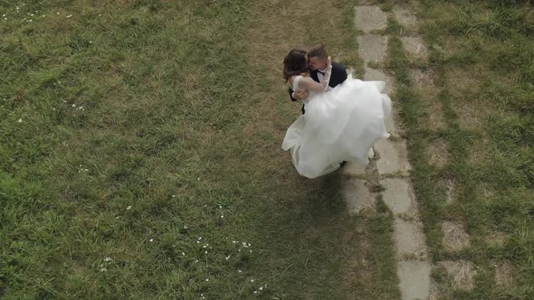 Caucasian Groom with Bride in the Park. Wedding Couple. Happy Family. Newlyweds