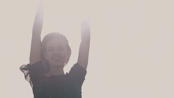 Lady with Raised Hands Poses at Sunlight Closeup Slow Motion