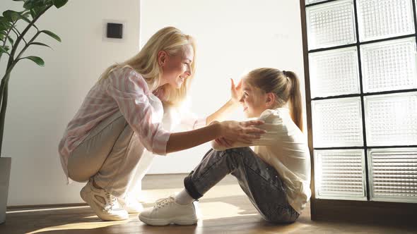 Portrait of Child with Mother Sitting Together Suffering From Cruel Father