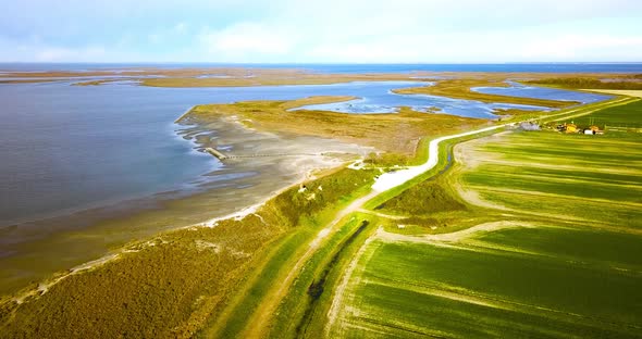 Distant Pier with Tourist Bridge Among Thickets and Lagoon