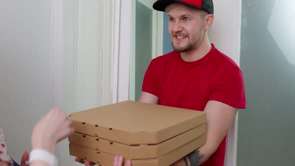 Delivery Man with Pizza Boxes Ringing on Doorbell Woman with Child Opens Doors Pay Cash for Order