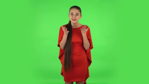 Pretty Young Displeased Woman Is Indignantly Talking To Someone, Then Cries. Green Screen