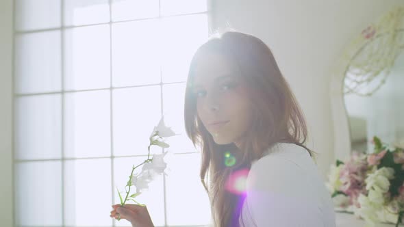 Young Beautiful Girl in White Decor